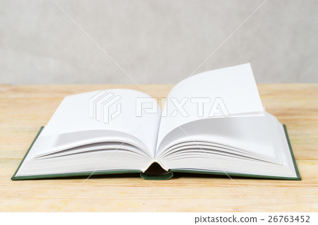 Open book on wooden table. Back to school. Copy 26763452
