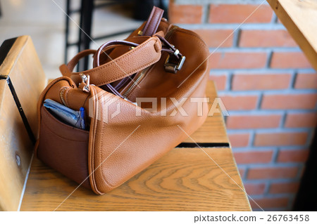 Lady bag on chair in cafe  26763458