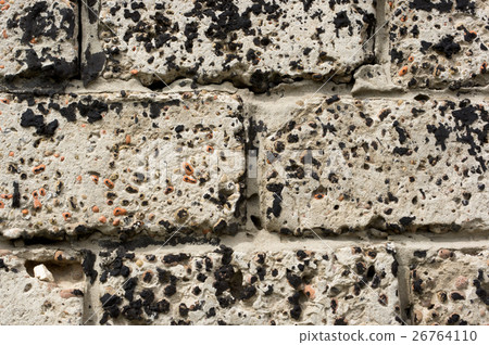 Wall made of concrete blocks, stained black resin 26764110