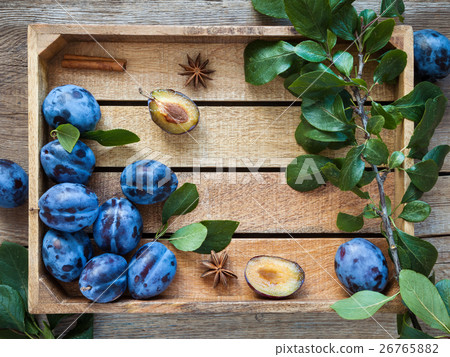 Fresh plums in wooden box. Top view, flat lay. Fresh plums in wooden box. Top view, flat lay. 26765882