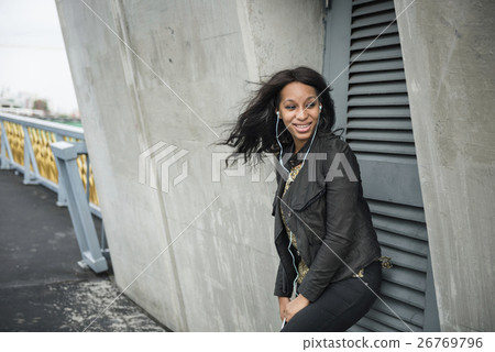 African Woman Listening Music Media Entertainment Relaxation Concept African Woman Listening Music Media Entertainment Relaxation Concept 26769796