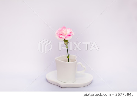 Coffee cup and one carnation Coffee cup and one carnation 26773943