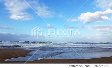 Deserted beach near the blue sea 26774080