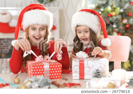 Sisters with Christmas gifts Sisters with Christmas gifts 26779618