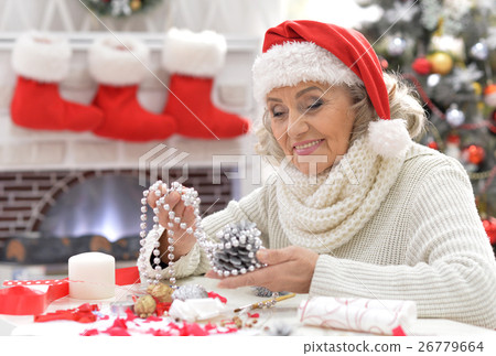 Senior woman in Santa hat 26779664