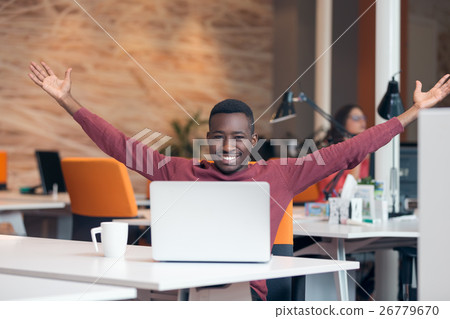Happy successful African American businessman in a 26779670