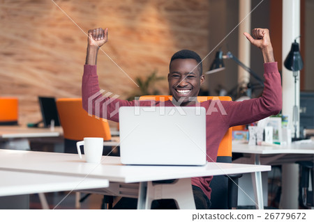 Happy successful African American businessman in a 26779672