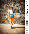 A girl stands near the icon 26779746