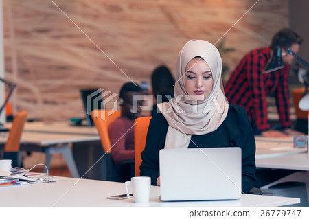 Arabic business woman wearing hijab,working in Arabic business woman wearing hijab,working in 26779747