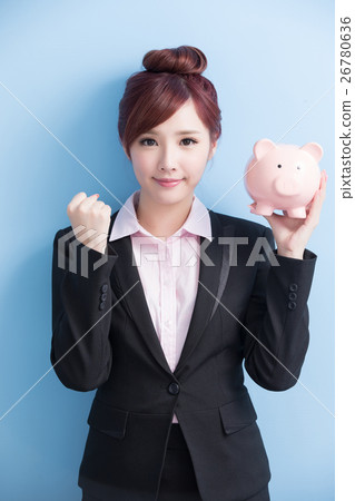 woman take pink piggy bank woman take pink piggy bank 26780636
