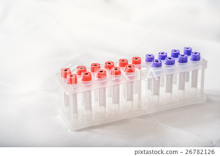 Glass test-tubes on medical bed Glass test-tubes on medical bed 26782126