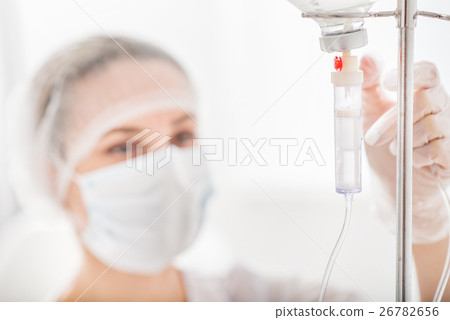 Skillful general practitioner working with drop Skillful general practitioner working with drop 26782656