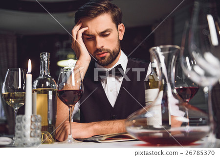 Man looking at wine with lost sight 26785370