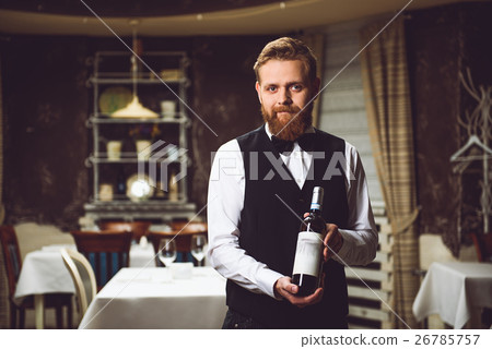 Man presenting bottle of wine Man presenting bottle of wine 26785757
