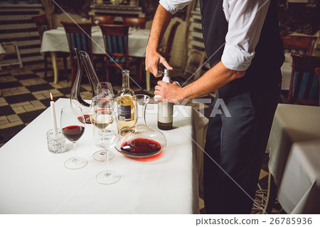 Opening bottle with white wine 26785936