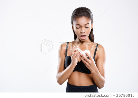 Girl in underwear is holding cream can Girl in underwear is holding cream can 26786013