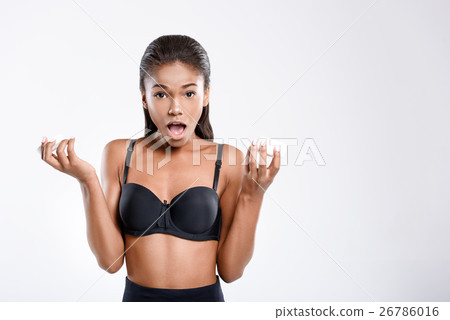 Young mulatto woman with a jar of cream Young mulatto woman with a jar of cream 26786016