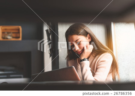 Thoughtful girl looking at screen 26786356