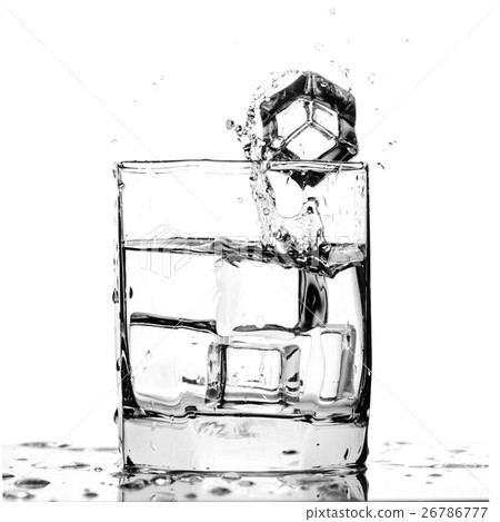 Ice cube splashing in a cool glass of water Ice cube splashing in a cool glass of water 26786777