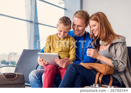 Family waiting for departure at airport 26788344