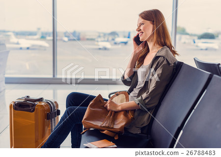 Smiling girl waiting for boarding 26788483