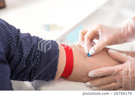 Professional general practitioner undergoing blood Professional general practitioner undergoing blood 26789179