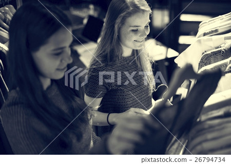 Girls Choosing Clothes Shopping Concept 26794734