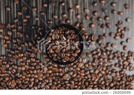 Coffee cup and beans on wooden background. Top Coffee cup and beans on wooden background. Top 26800090