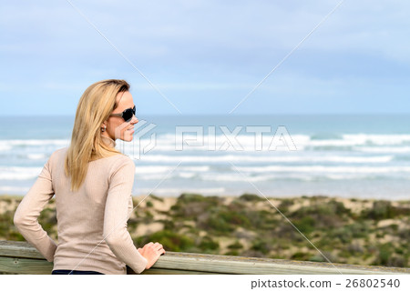Woman enjoying the sea view at Goolwa beach 26802540