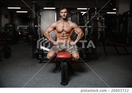 Strong and handsome athletic young man muscles abs and biceps. Strong and handsome athletic young man muscles abs and biceps. 26803722