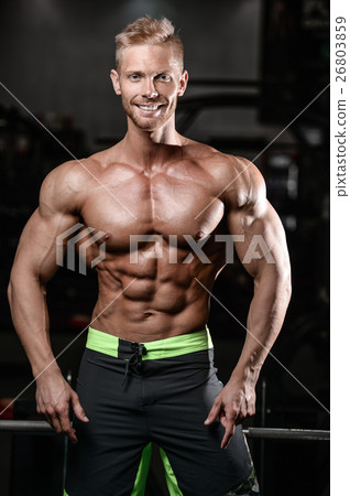Strong and handsome athletic young man muscles 26803859