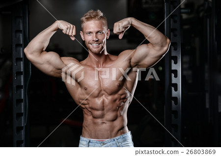 Strong and handsome athletic young man muscles Strong and handsome athletic young man muscles 26803869