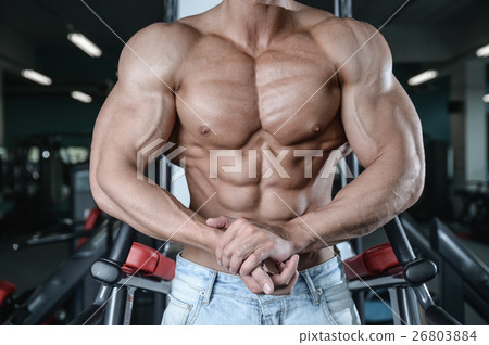 Strong and handsome athletic young man muscles Strong and handsome athletic young man muscles 26803884