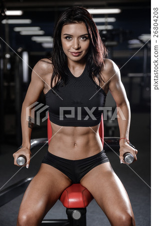 sexy brunette fitness woman after workout in gym 26804208