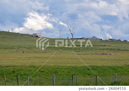 Ominous dramatic storm clouds over farmland Ominous dramatic storm clouds over farmland 26804510