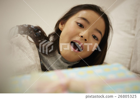 Child in the morning surprised by gifts 26805325
