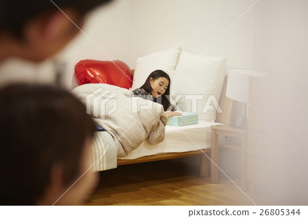 Child in the morning surprised by gifts 26805344