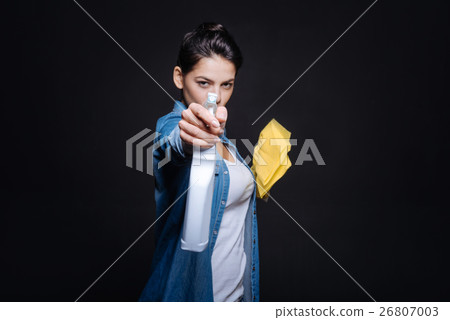 Funny young woman preparing for cleaning Funny young woman preparing for cleaning 26807003