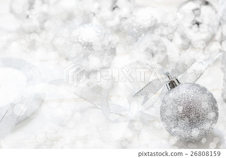 Silver Christmas ball on white spakles bokeh Silver Christmas ball on white spakles bokeh 26808159