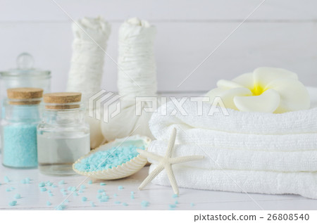White towel with Plumeria flower and spa tools White towel with Plumeria flower and spa tools 26808540