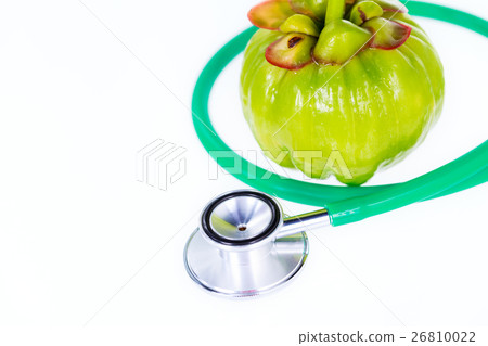 Closeup garcinia cambogia and stethoscope  26810022