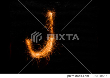Letter J made of sparklers on black Letter J made of sparklers on black 26810833