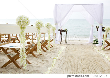 flower decoration chair at wedding venue on beach 26812104