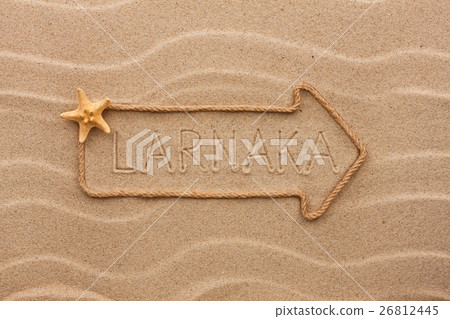 Stock Photo: Arrow made of rope and starfish word Larnaca