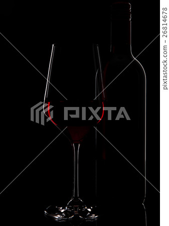 Glass of red wine with bottle close up on black 26814678