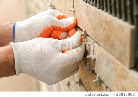 Installing the tiles on the wall. Installing the tiles on the wall. 26815008