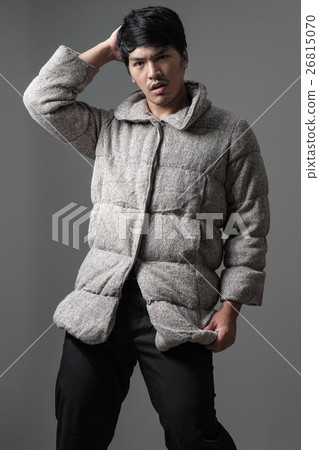 Portrait of Asian man in gray knitting coat 26815070