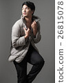 Portrait of Asian man in gray knitting coat 26815078