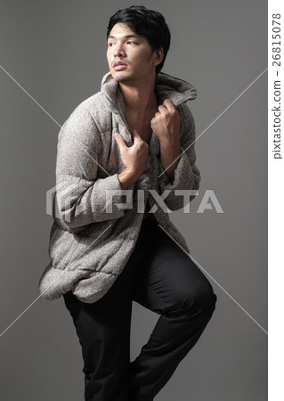 Portrait of Asian man in gray knitting coat 26815078