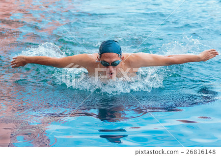swimmer in cap breathing performing the butterfly swimmer in cap breathing performing the butterfly 26816148